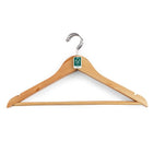 A light natural wood hanger with a silver metal hook and a small green recycling tag attached to the collar, shown against a plain white background.