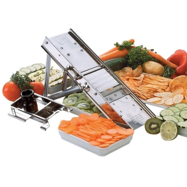 Bron stainless-steel mandoline displayed with its safety guard and assorted sliced fruits and vegetables.