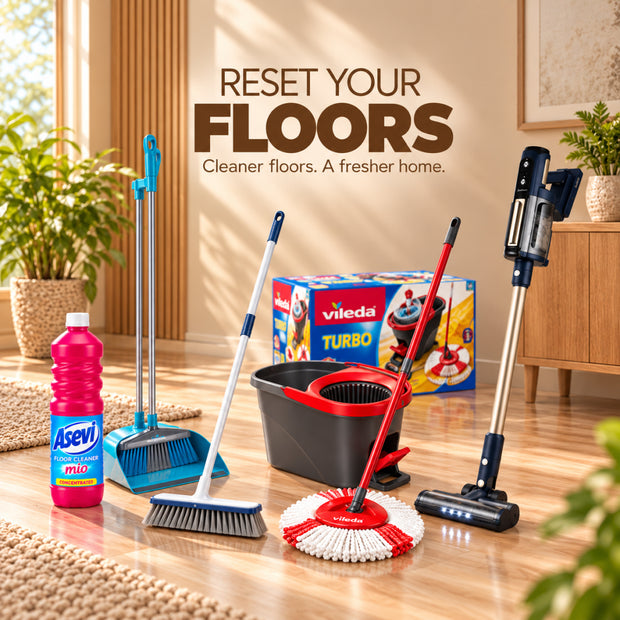 A Vileda Turbo floor cleaning set arranged on a wooden floor in a bright room, including a mop, brush, dustpan, bucket, and a handheld vacuum cleaner, with a bottle of ASEVI floor cleaner and a product box. Large text reads 'RESET YOUR FLOORS' and 'Cleaner floors.