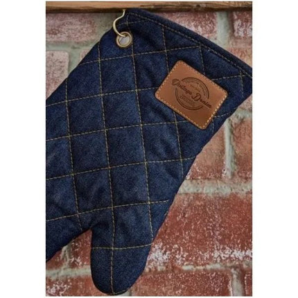 Close-up of Cooksmart Oxford Denim quilted single oven glove with hanging loop and brown Vintage Denim label.