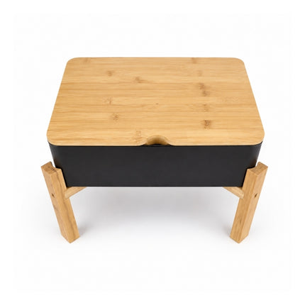 High-angle view of the rectangular Dalebrook Nimble buffet stand with black tray and notched bamboo lid.
