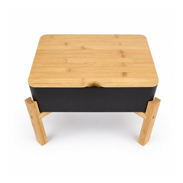 High-angle view of the rectangular Dalebrook Nimble buffet stand with black tray and notched bamboo lid.