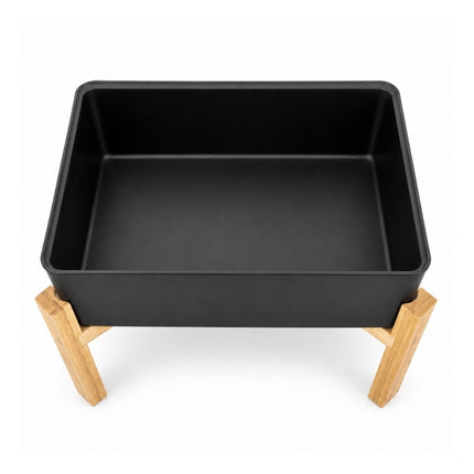Open black serving tray supported by the four-legged bamboo frame of the Dalebrook Nimble buffet stand.