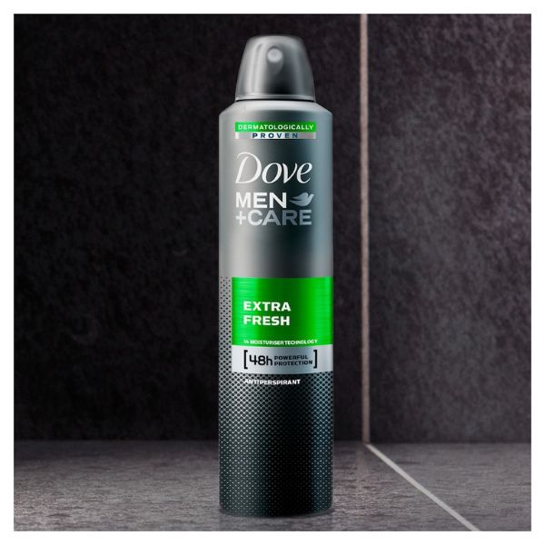 Dove Men+Care Extra Fresh 250ml antiperspirant deodorant spray with 48-hour protection, displayed against a dark bathroom background.