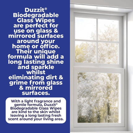 Duzzit biodegradable glass wipes beside a clean window, highlighting use on glass and mirrors to remove dirt and grime and leave lasting shine.