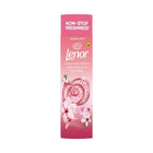 Lenor Cherry Blossom and Rose Water 275g in-wash scent booster beads in a pink container decorated with cherry blossoms.