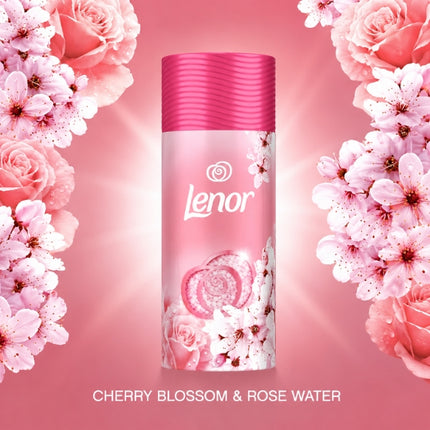 Lenor Cherry Blossom and Rose Water scent booster container surrounded by pink cherry blossoms and roses.