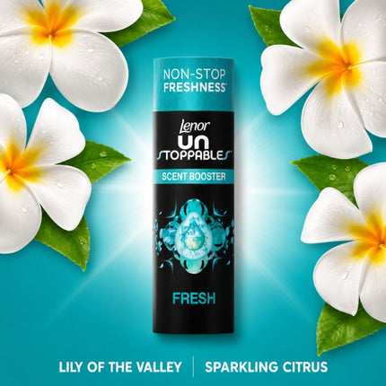 Lenor Unstoppables Fresh scent booster surrounded by white flowers, illustrating its lily-of-the-valley and sparkling-citrus fragrance notes.