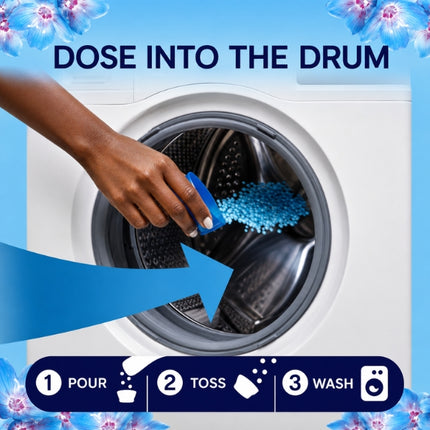Hand pouring blue Lenor scent booster beads directly into a washing machine drum, with three steps: pour, toss in laundry and wash.