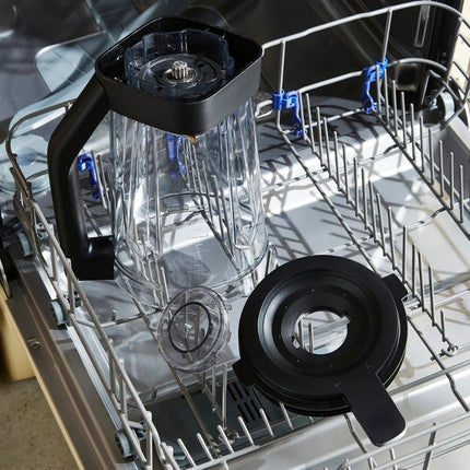Morphy Richards blender jug, lid and removable cap arranged in a dishwasher rack for cleaning.
