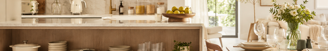 Bright modern kitchen and dining area featuring cookware, dinnerware, glassware, table linens and home décor