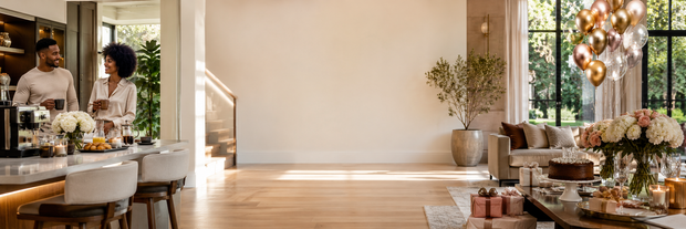 Birthday registry banner with a couple enjoying coffee, balloons, flowers, cake and wrapped gifts in a modern home