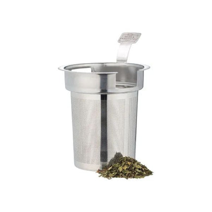 A stainless steel mesh tea infuser with a folding handle, shown on a white background with a small pile of loose-leaf tea in front.