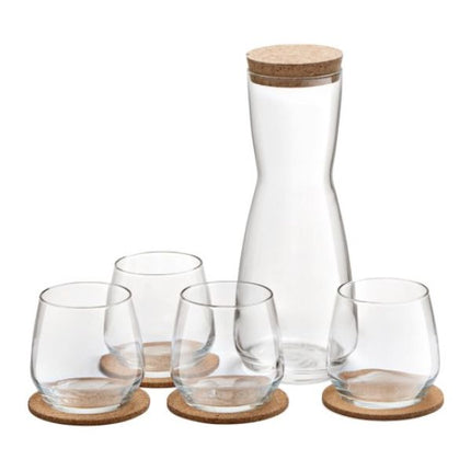 Clear glass carafe and tumblers with wooden bases on a white background