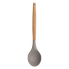 Sabichi grey silicone solid spoon with a light wooden handle and hanging hole on a white background.