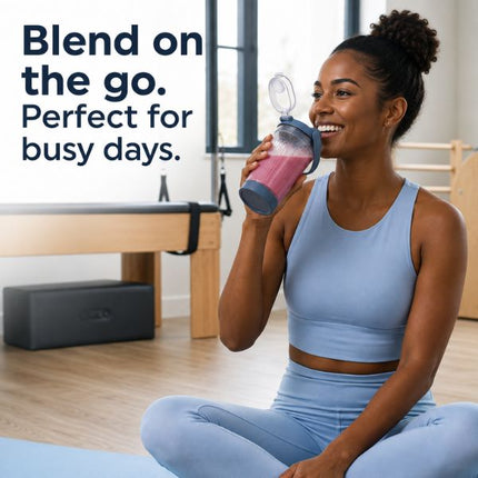 A woman in a light blue activewear set sits on a yoga mat in a bright studio, holding a translucent shaker bottle with a pink drink. Large text on the left reads, 'Blend on the go.
