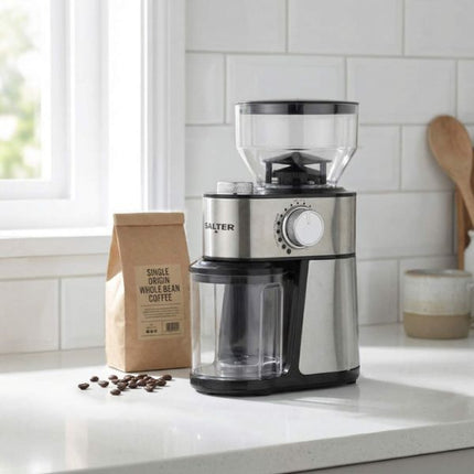 Salter coffee grinder on a kitchen counter with coffee beans and a bag of coffee.