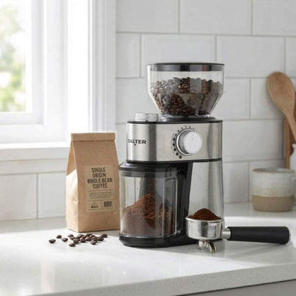 Salter coffee grinder on a kitchen counter with coffee beans and a bag of coffee.