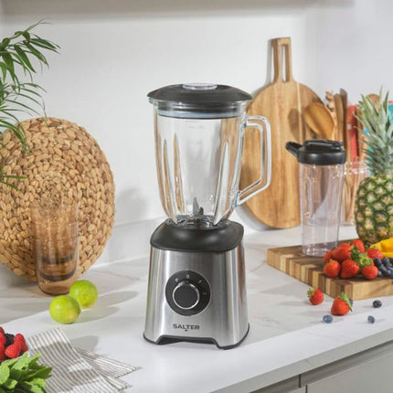 Salter blender on a kitchen counter with fruits and vegetables around