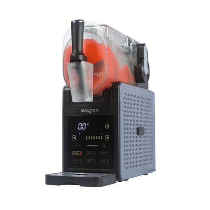 A Salter frozen dessert machine with a black control base, a clear ice bucket containing orange frozen slushie, and a gray textured side panel, shown on a plain white background.