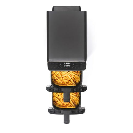 A black multi-tier air fryer shown from a top-down view on a white background, with two baskets filled with french fries and a digital temperature display showing 230C.