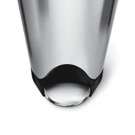 Close-up of Simplehuman 18L butterfly pedal bin showing its wide stainless steel foot pedal, black base and brushed steel body.