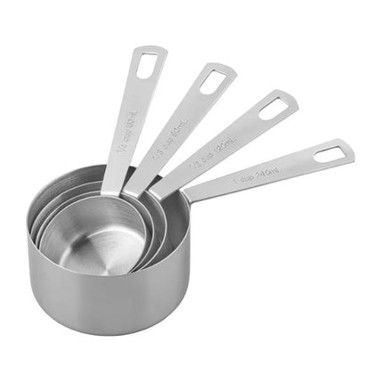 Set of stainless steel measuring cups on a white background
