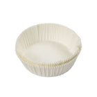 White cupcake liner with gold trim on a white background