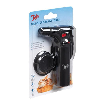 Tata Mini Cook's Blow Torch in its original retail blister packaging, featuring a black handheld torch with a red ignition button and a black nozzle cap.