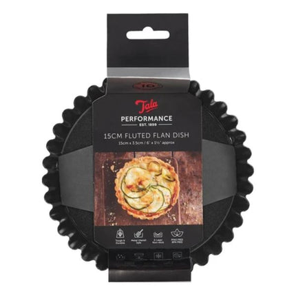 A packaged black 15cm fluted flan dish by Tala Performance, shown in its retail hanging sleeve against a plain white background.