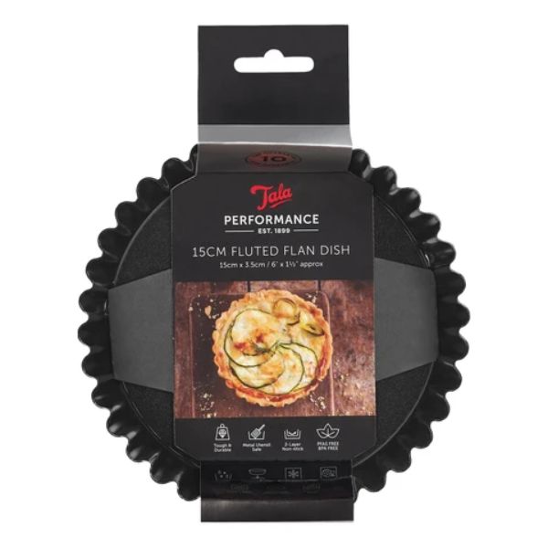 A packaged black 15cm fluted flan dish by Tala Performance, shown in its retail hanging sleeve against a plain white background.