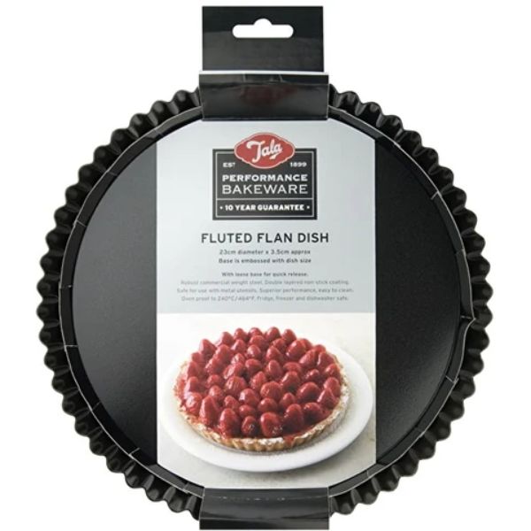 Fluted flan dish with packaging featuring a pie with berries on a white background