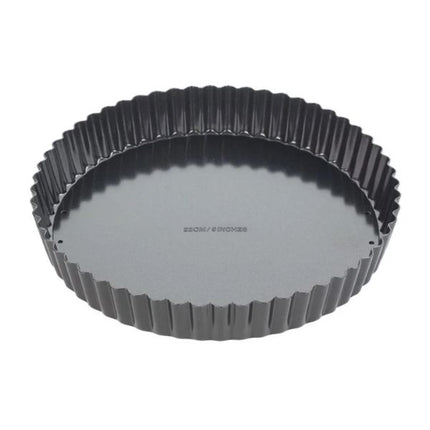 A round fluted tart pan in dark gray non-stick coating, shown from a top-down angle on a plain white background.