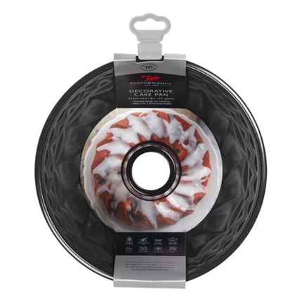 Decorative cake pan with a bundt cake on a white background