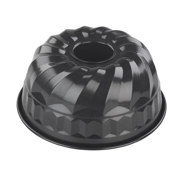 A black fluted bundt cake pan with a center hole, shown from a top-down angle on a plain white background.