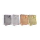 Four Tallon glitter gift bags with ribbon handles in dark silver, light silver, rose gold and gold.