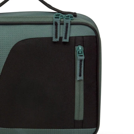 Close-up of the Thermos Radiance 4L green lunch bag’s black front panel, showing the double-zip closure and vertical pocket zipper.