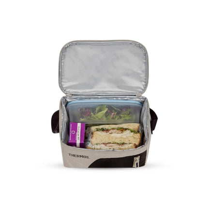 Open Thermos Sandstone Radiance 4.5L insulated cooler bag packed with a salad container, sandwiches and a drink carton.