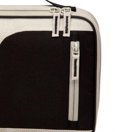 Close-up of the Thermos Sandstone Radiance 4L lunch bag’s black front panel, showing the cream double zippers and vertical pocket zip.