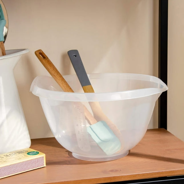 Wham Cuisine 4L clear mixing bowl on a kitchen shelf holding wooden spoons and spatulas, with measurement markings visible.